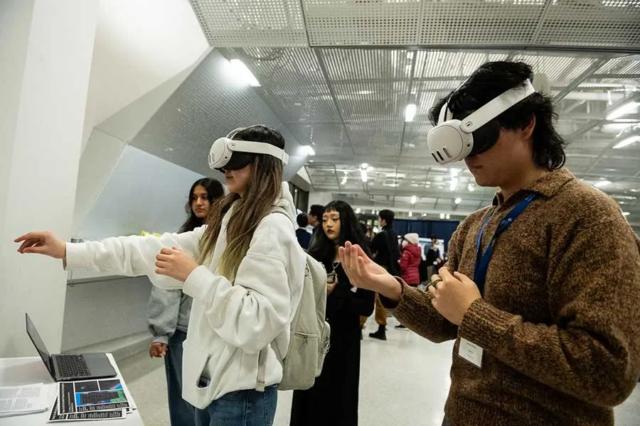 two people testing virtual reality headsets