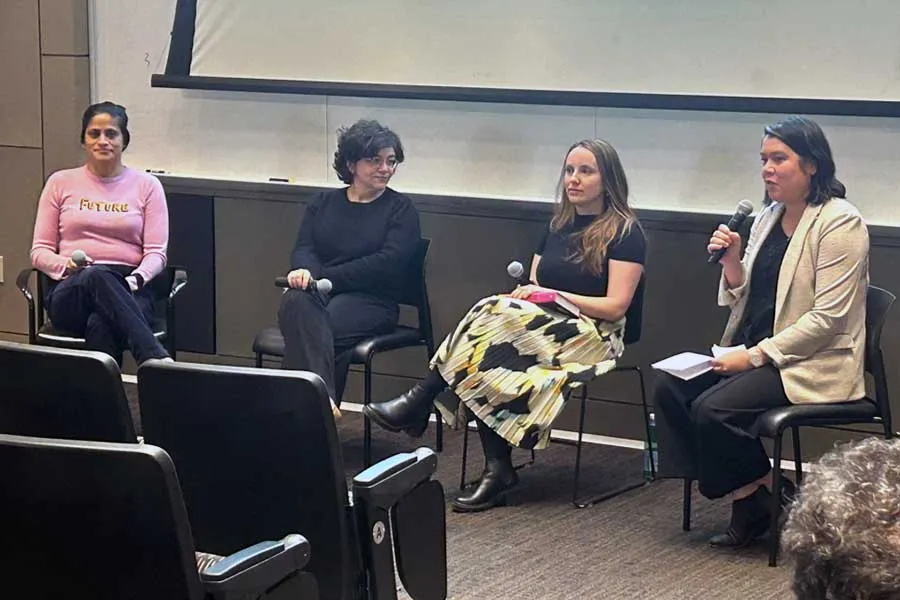 four female panelists during a presentation