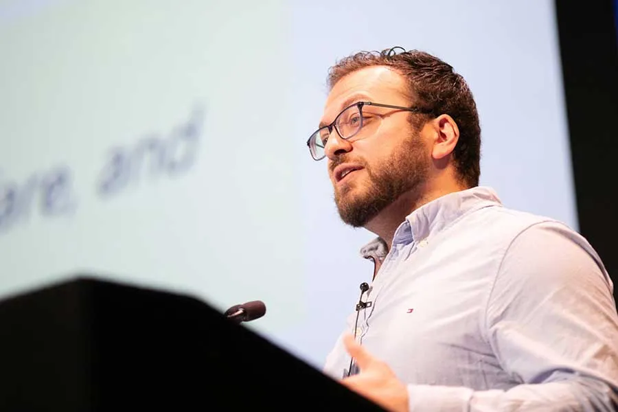 photo of man talking at a lecturn