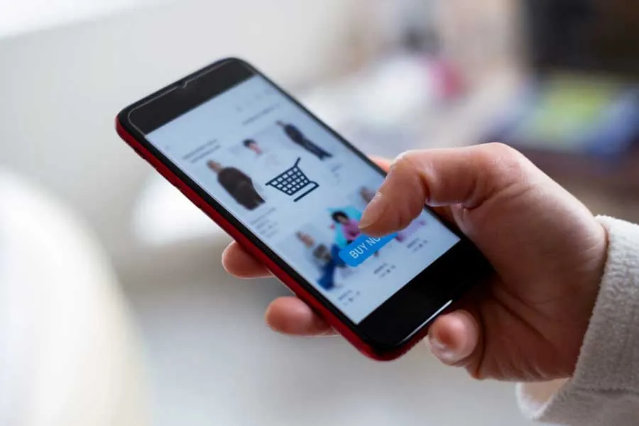 person's hand with mobile phone in it