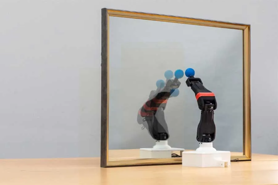 robot looking in a mirror