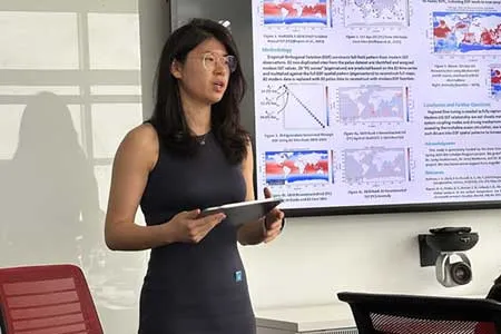  A female student giving a presentation in a classroom