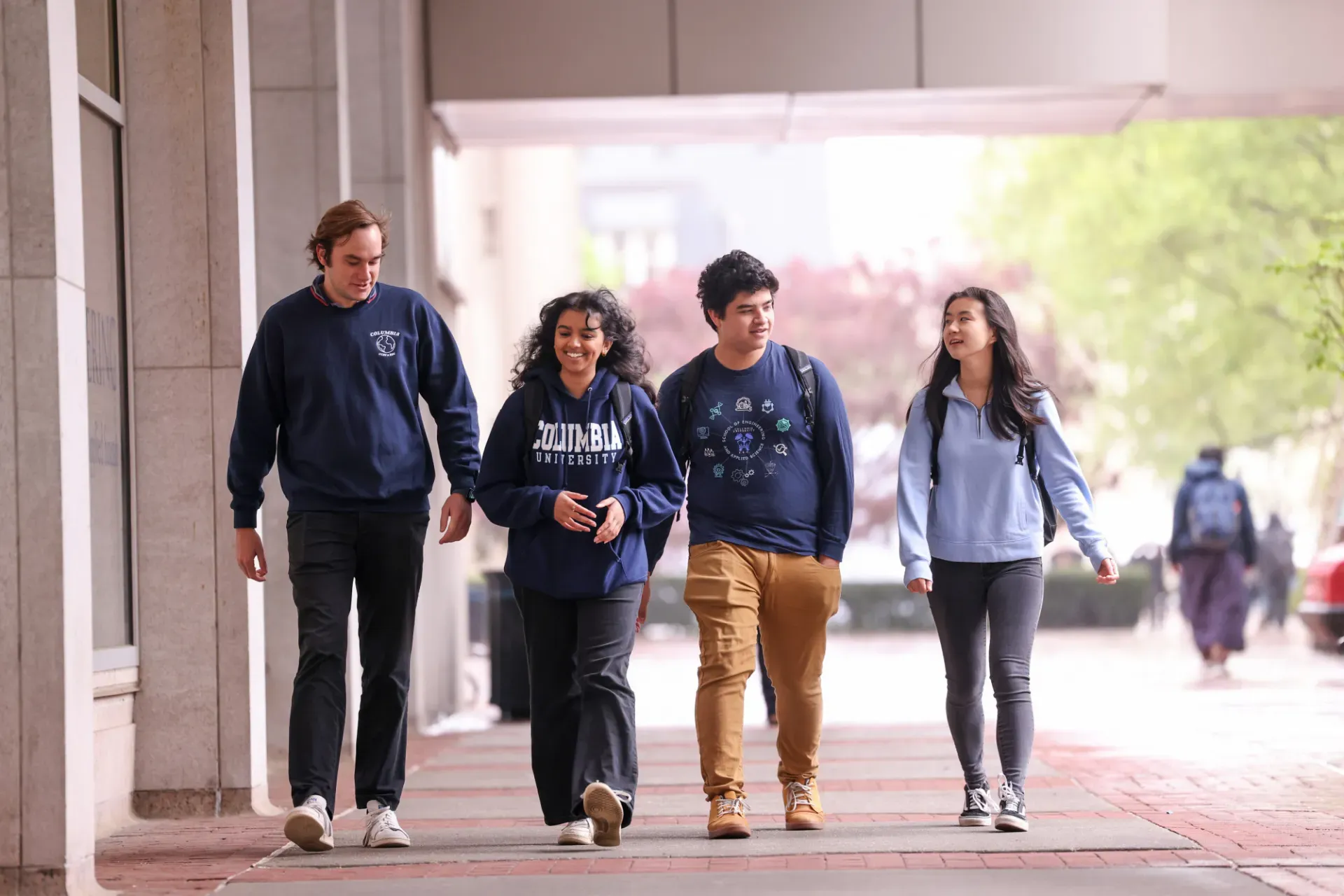 Four Columbia students walking together_photo by John Abbott