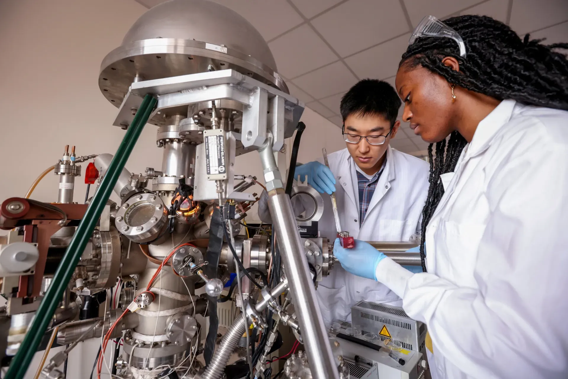 two researchers reviewing lab project_photo by John Abbott