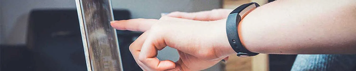 hand pointing to laptop screen