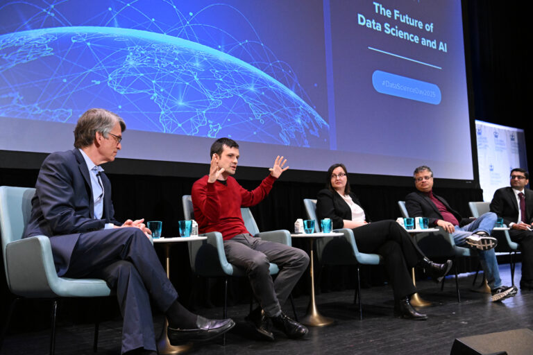 Panelists engaging onstage