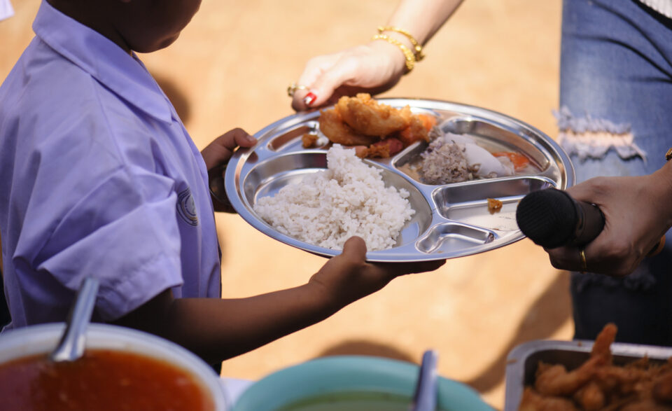 Philanthropists donate food to the poor, share food, help each other in society.